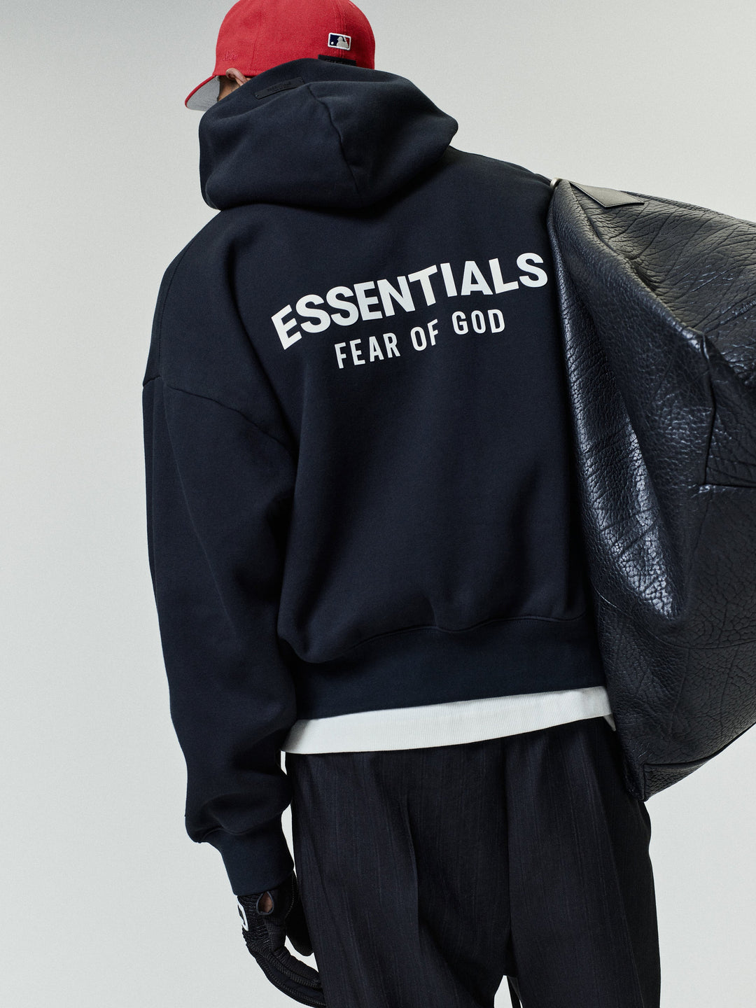 Black pullover hoodie with kangaroo pocket and back text graphic
