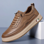 Low-top lace-up trainers with stitched panels and a contrast sole