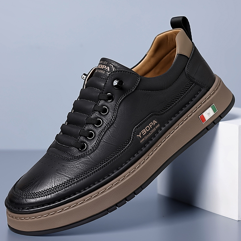 Low-top lace-up trainers with stitched panels and a contrast sole
