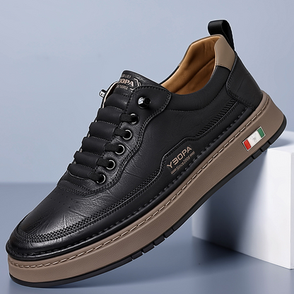 Low-top lace-up trainers with stitched panels and a contrast sole