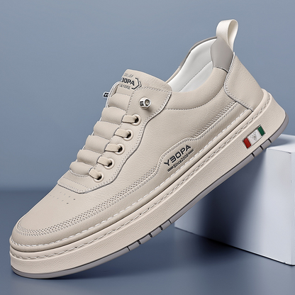Low-top lace-up trainers with stitched panels and a contrast sole