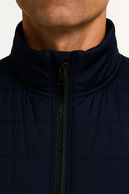 Men's quilted sleeveless puffer vest with mock neck and zip pockets