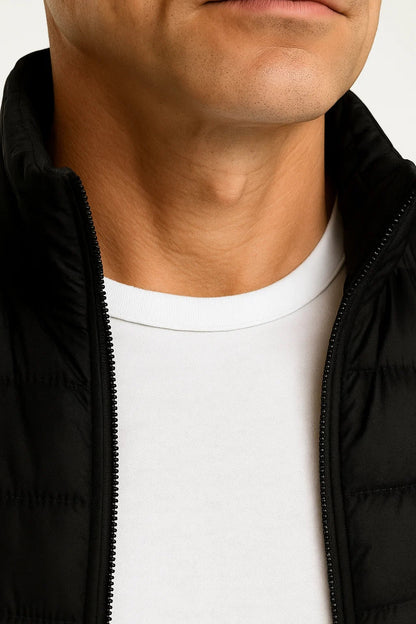 Men's quilted sleeveless puffer vest with mock neck and zip pockets