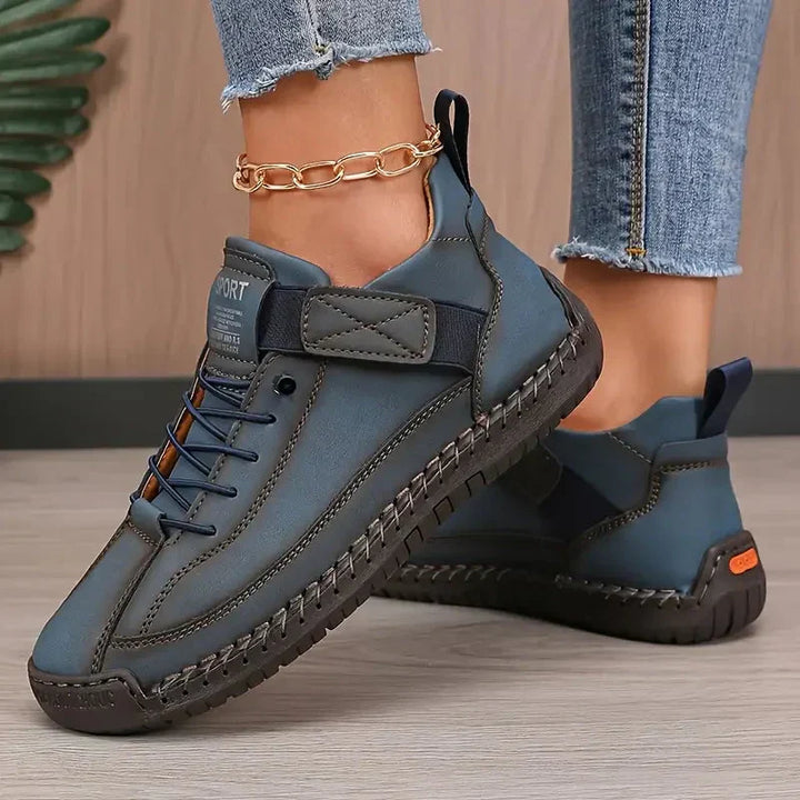 High top sneakers with laces, upper strap and contrast sole