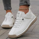 High top sneakers with laces, upper strap and contrast sole