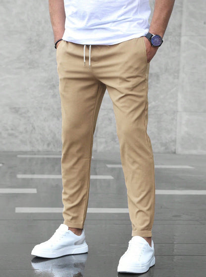 Men's tapered pull-on trousers with elasticated drawstring waist and side pockets