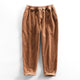 Corduroy pants with elastic waist, side pockets and tapered legs