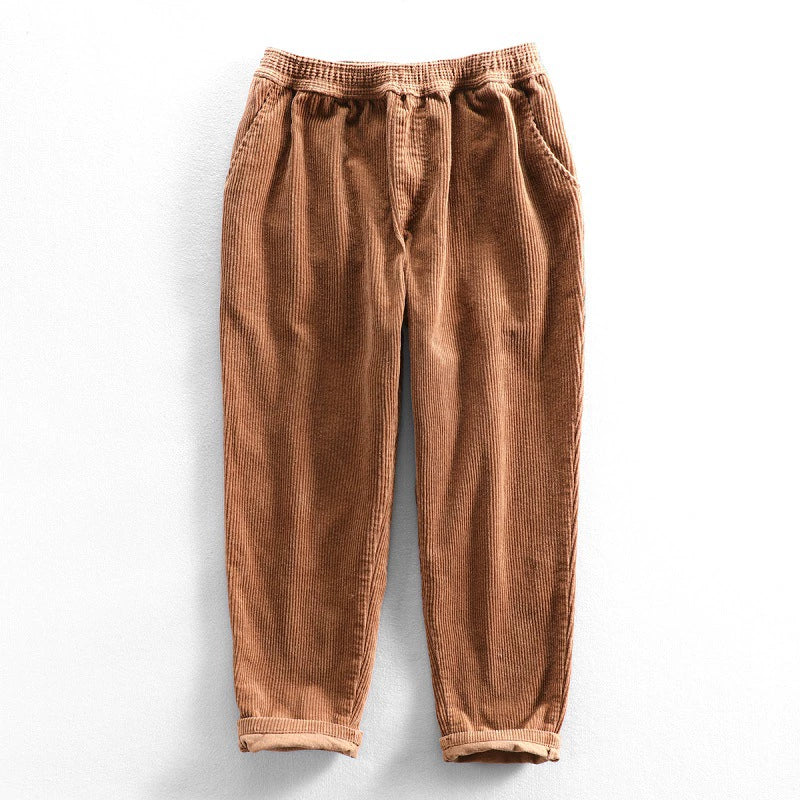 Corduroy pants with elastic waist, side pockets and tapered legs