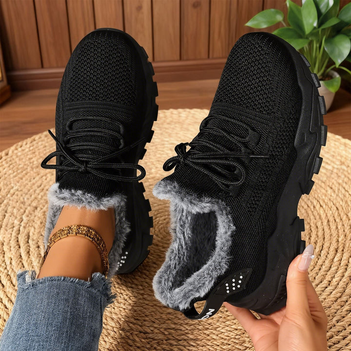 Lace-up trainers with textured uppers, deep tread soles and fleece-style lining