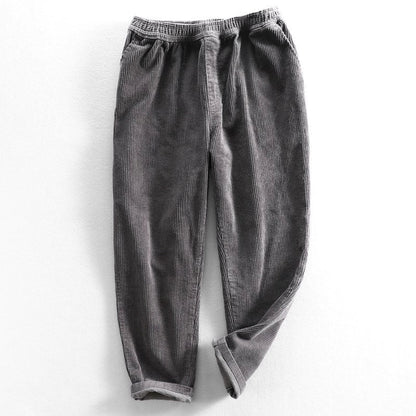 Corduroy pants with elastic waist, side pockets and tapered legs