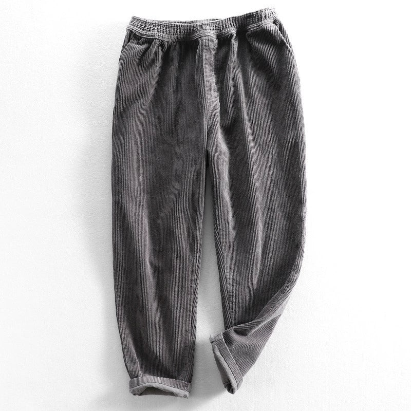 Corduroy pants with elastic waist, side pockets and tapered legs