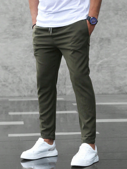 Men's tapered pull-on trousers with elasticated drawstring waist and side pockets