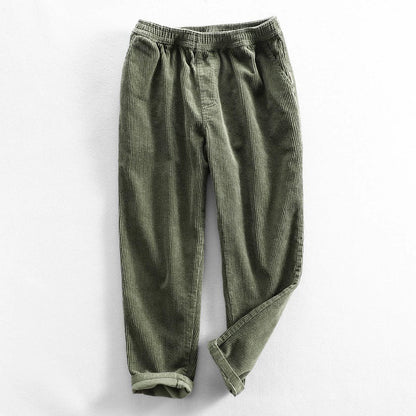Corduroy pants with elastic waist, side pockets and tapered legs