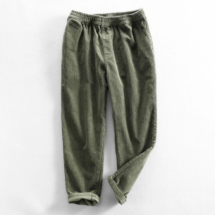 Corduroy pants with elastic waist, side pockets and tapered legs