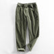 Corduroy pants with elastic waist, side pockets and tapered legs