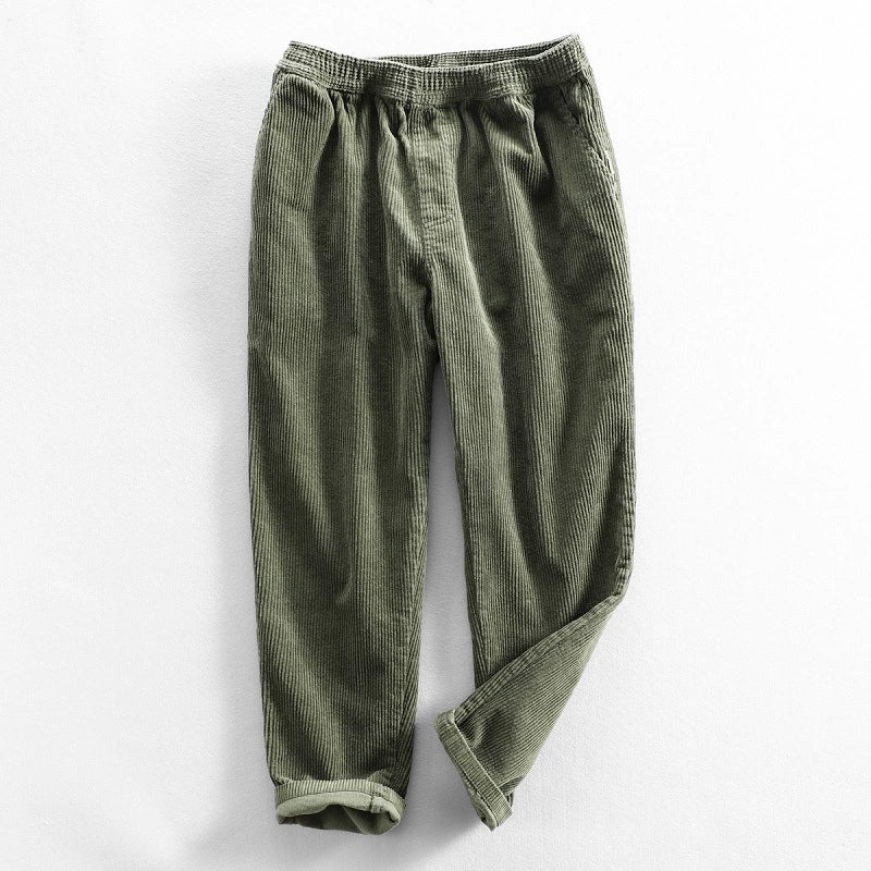 Corduroy pants with elastic waist, side pockets and tapered legs