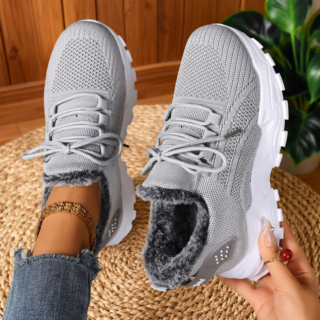 Lace-up trainers with textured uppers, deep tread soles and fleece-style lining