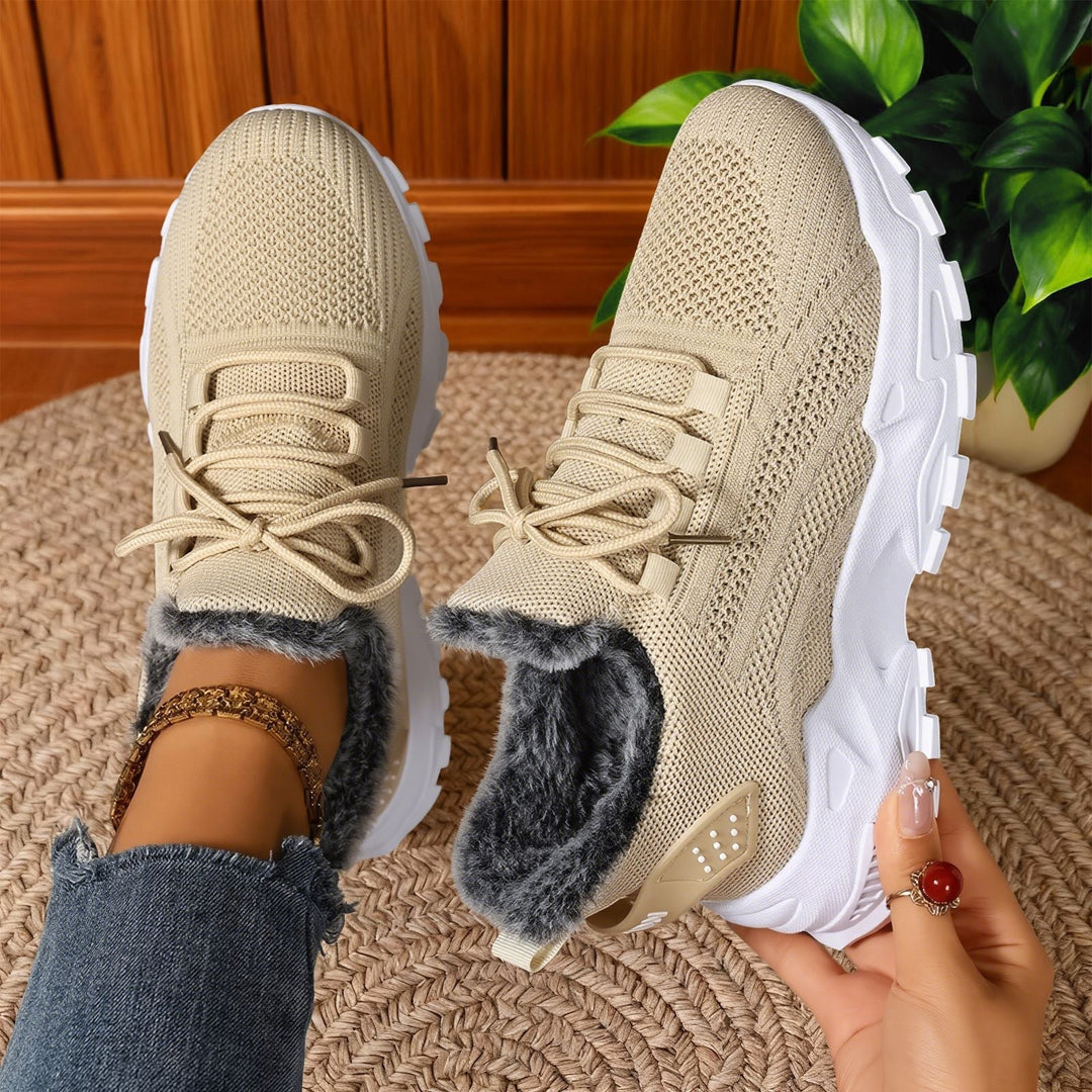 Lace-up trainers with textured uppers, deep tread soles and fleece-style lining