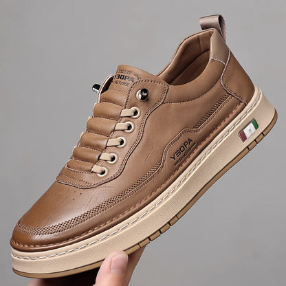 Low-top lace-up trainers with stitched panels and a contrast sole