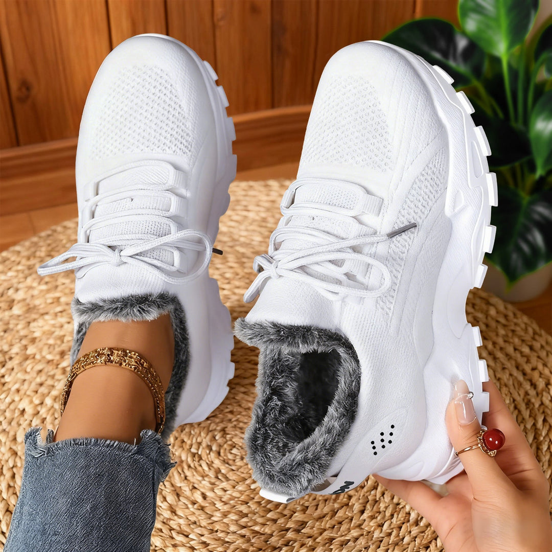 Lace-up trainers with textured uppers, deep tread soles and fleece-style lining