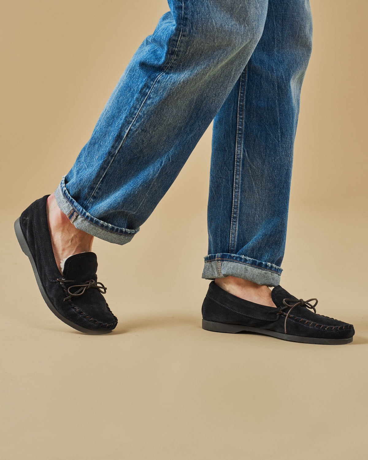 Men's navy suede moccasin loafers with lace detail and flat soles