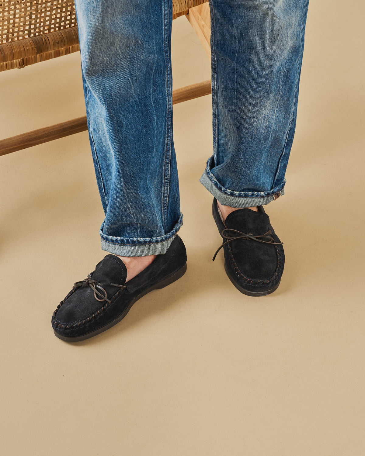 Men's navy suede moccasin loafers with lace detail and flat soles