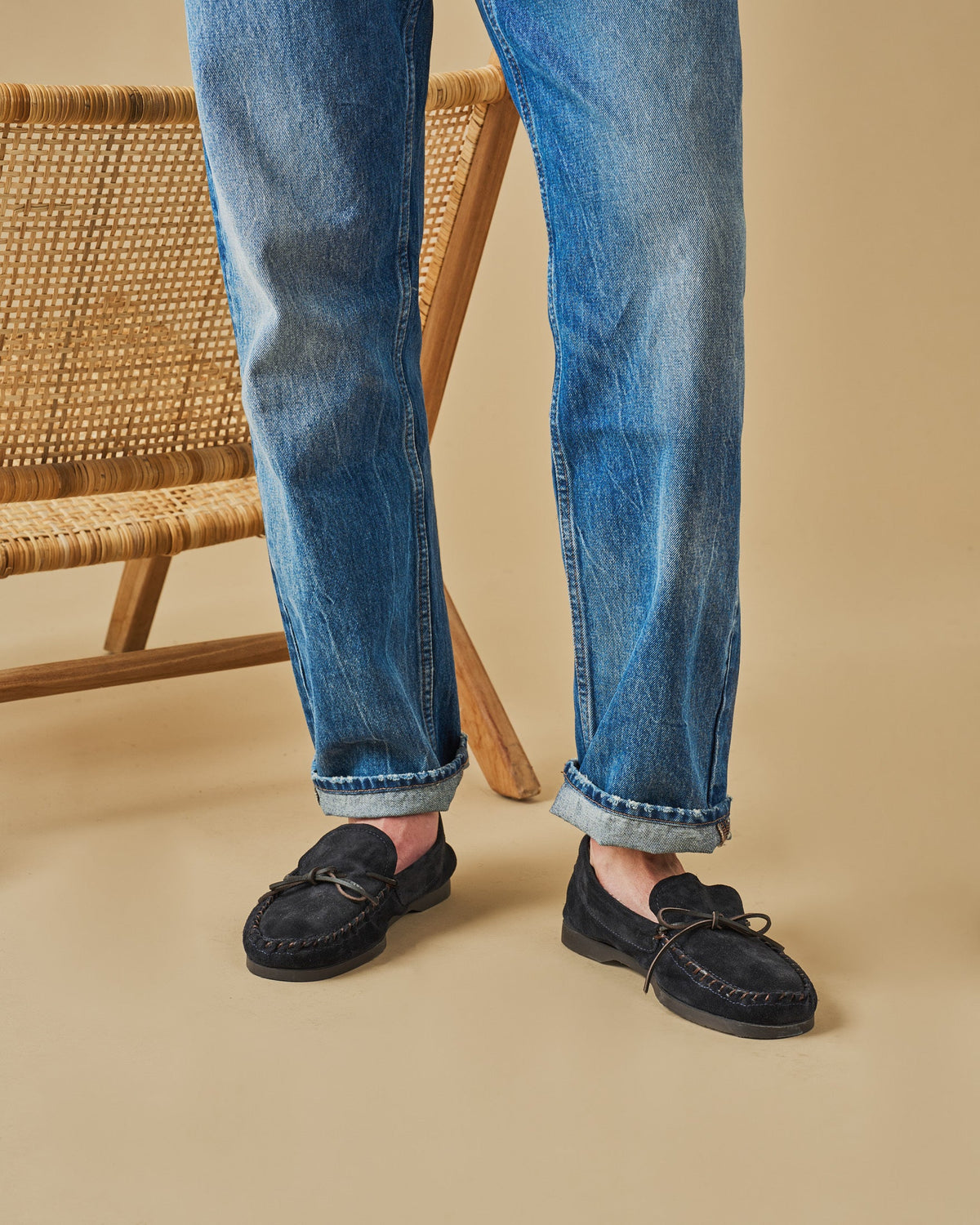 Men's navy suede moccasin loafers with lace detail and flat soles