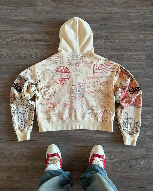 Beige zip-up hoodie with hood and all-over postal stamp graphic print