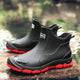 Black Chelsea ankle boots with elastic panels and lugged soles