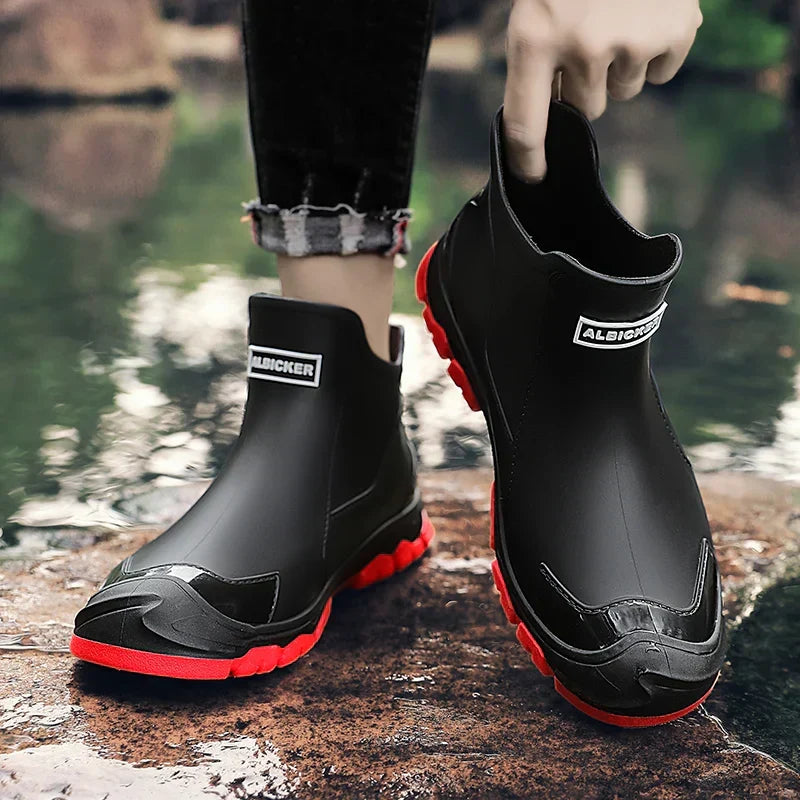 Black Chelsea ankle boots with elastic panels and lugged soles
