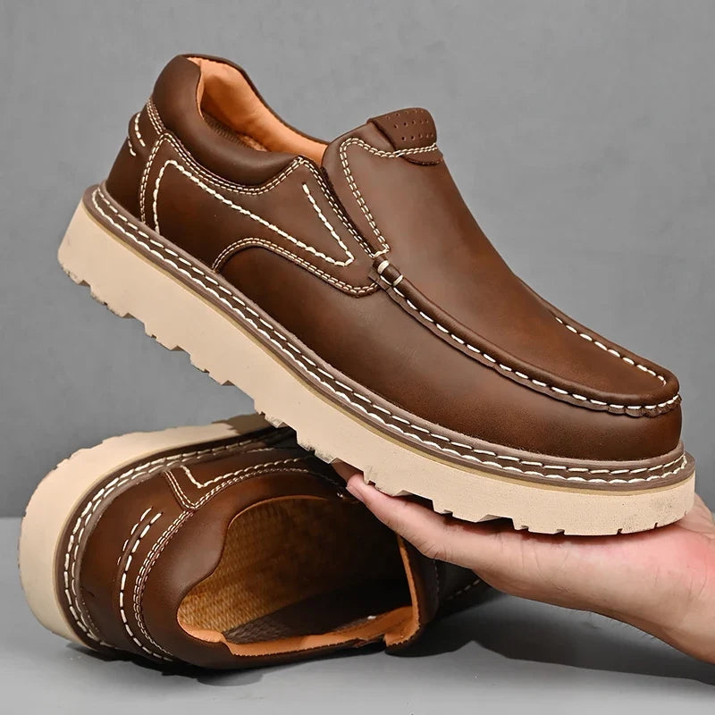 Slip-on moc toe loafers with contrast stitching and chunky lug soles
