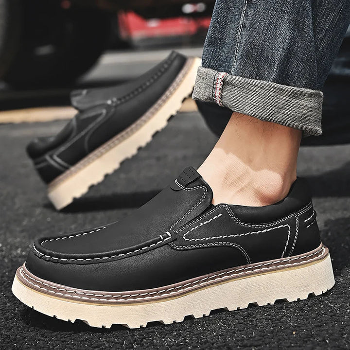 Slip-on moc toe loafers with contrast stitching and chunky lug soles