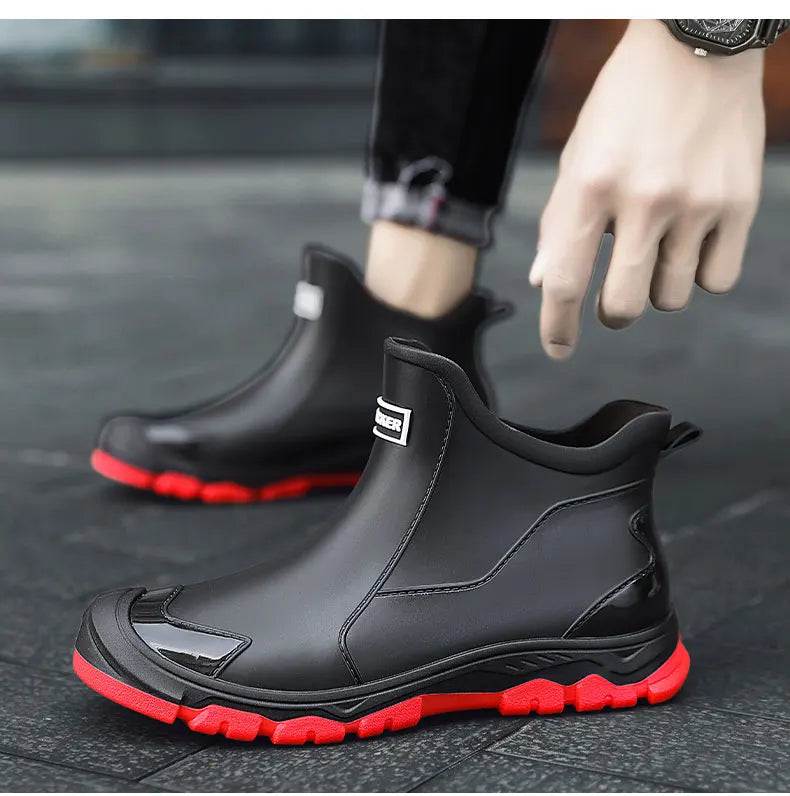 Black Chelsea ankle boots with elastic panels and lugged soles