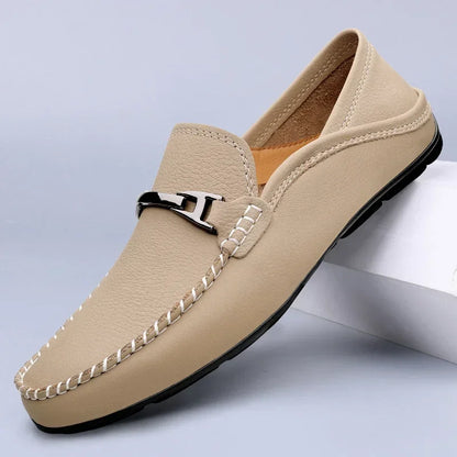 Slip-on loafers with moc toe stitching and a polished metal bar detail