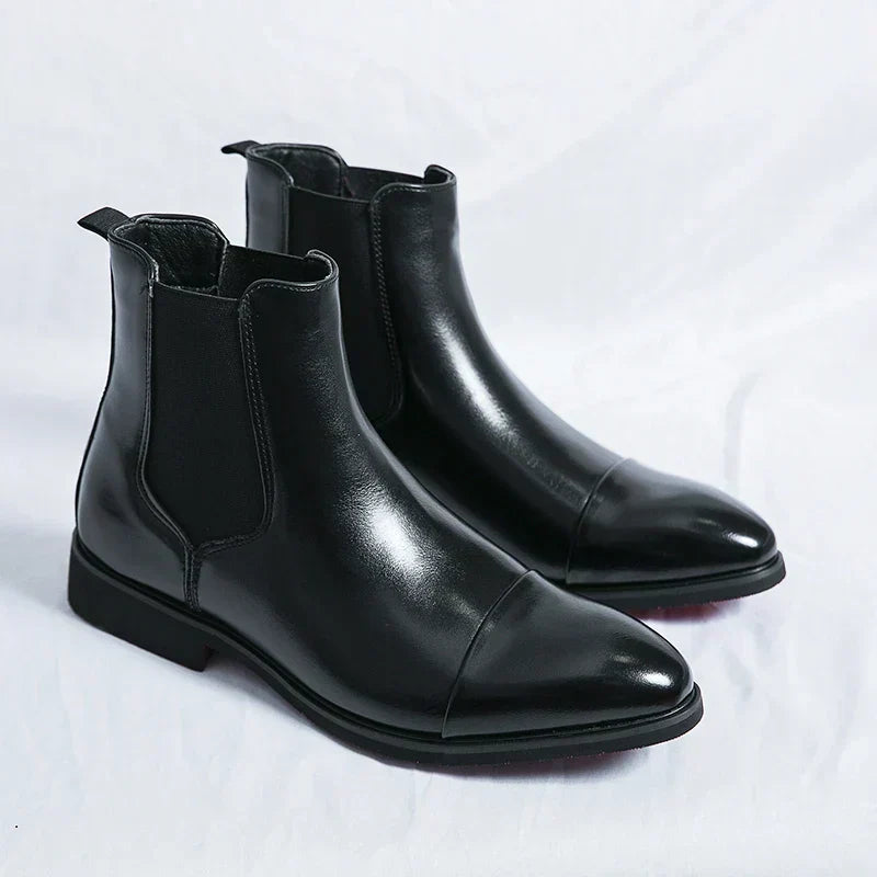 Men's Chelsea boots with square toes, elastic side panels and pull tabs shown in black and red