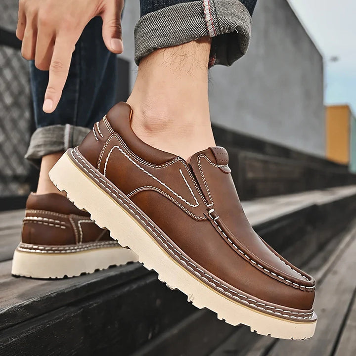Slip-on moc toe loafers with contrast stitching and chunky lug soles