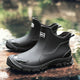 Black Chelsea ankle boots with elastic panels and lugged soles