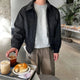 Men's collared zip jacket with long sleeves and button cuffs
