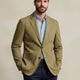 Men's blazer style jacket with notched lapels, long sleeves and patch pockets