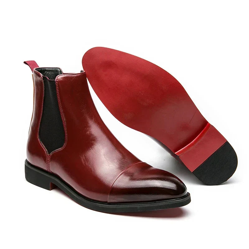 Men's Chelsea boots with square toes, elastic side panels and pull tabs shown in black and red