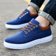 Men's low-top lace-up sneakers with white soles