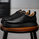 Leather lace-up sneakers with textured side panels