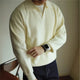 Men's long sleeve textured knit polo shirt with a collared neckline