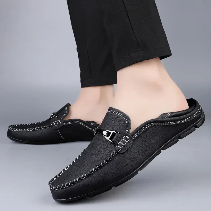 Slip-on loafers with moc toe stitching and a polished metal bar detail