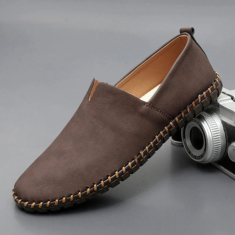 Men's dark brown leather loafers with contrasting stitched moc-toe and trim