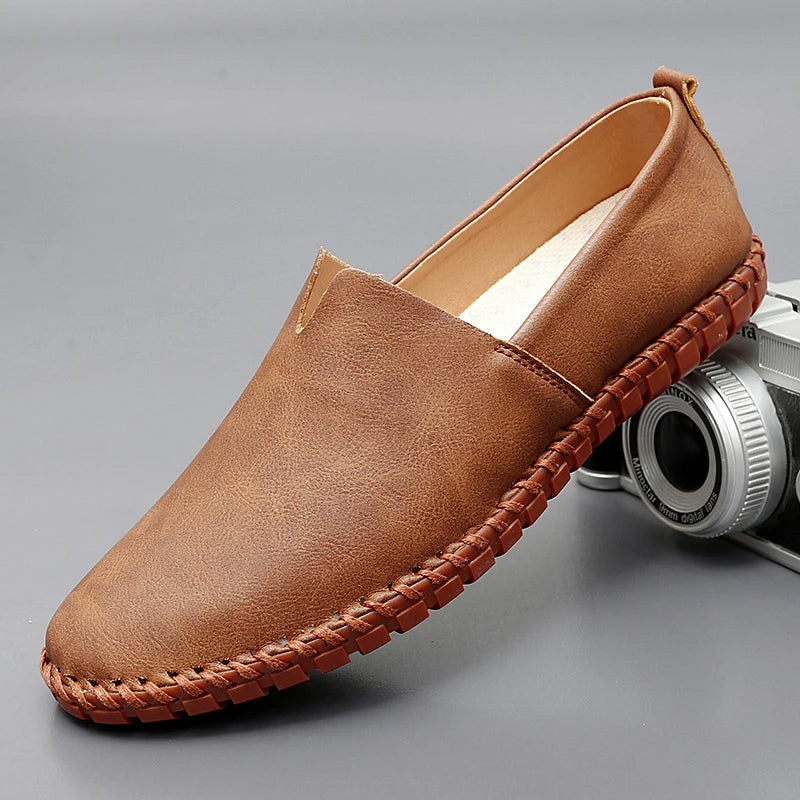 Men's dark brown leather loafers with contrasting stitched moc-toe and trim