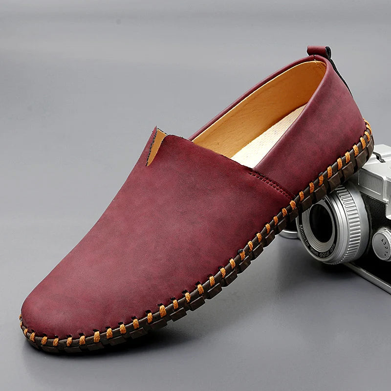 Men's dark brown leather loafers with contrasting stitched moc-toe and trim