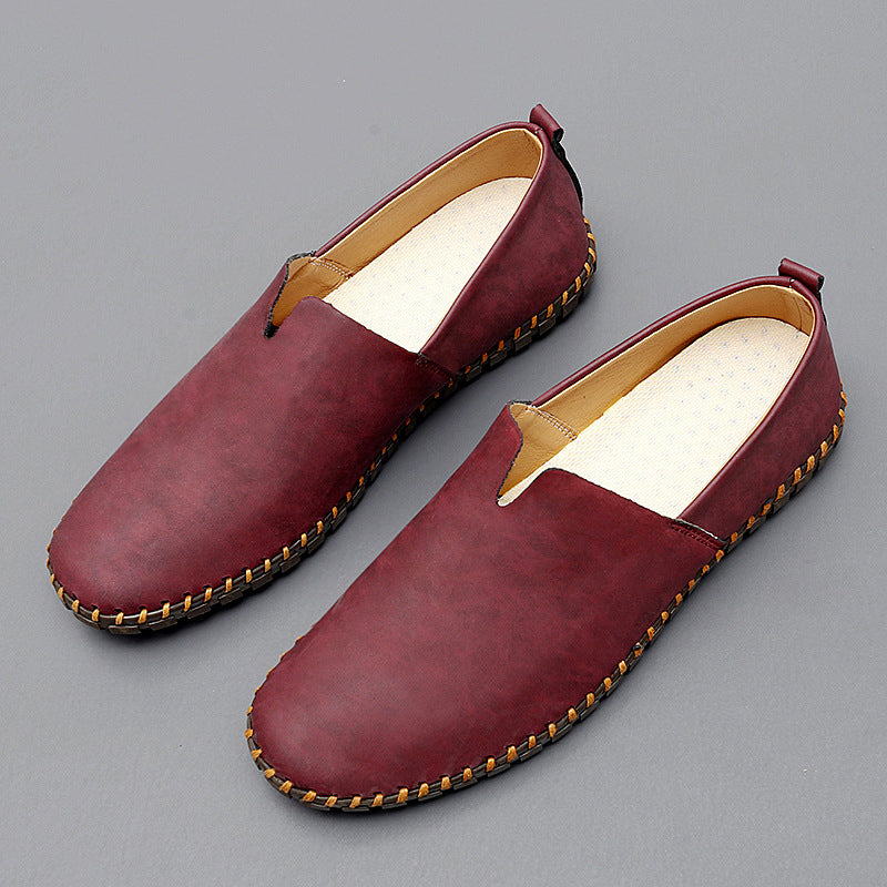 Men's dark brown leather loafers with contrasting stitched moc-toe and trim