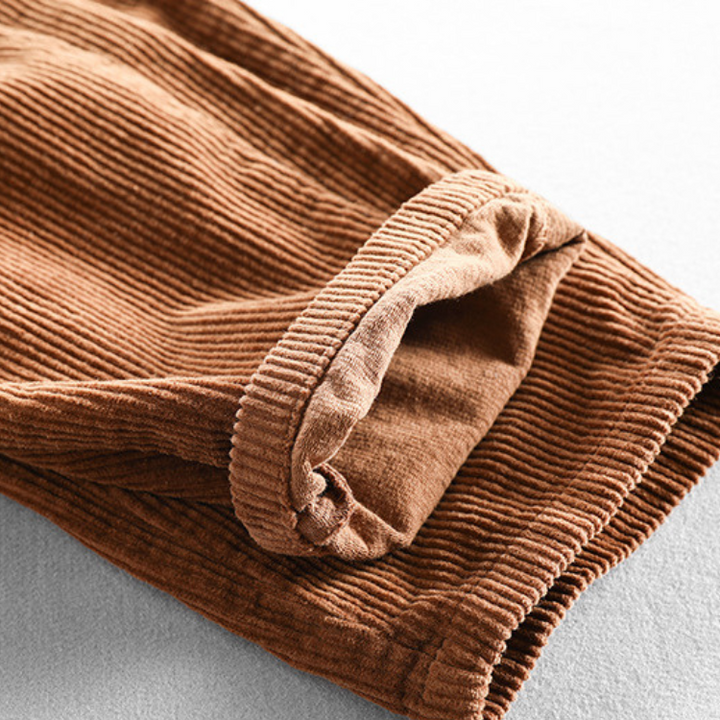 Corduroy pants with elastic waist, side pockets and tapered legs