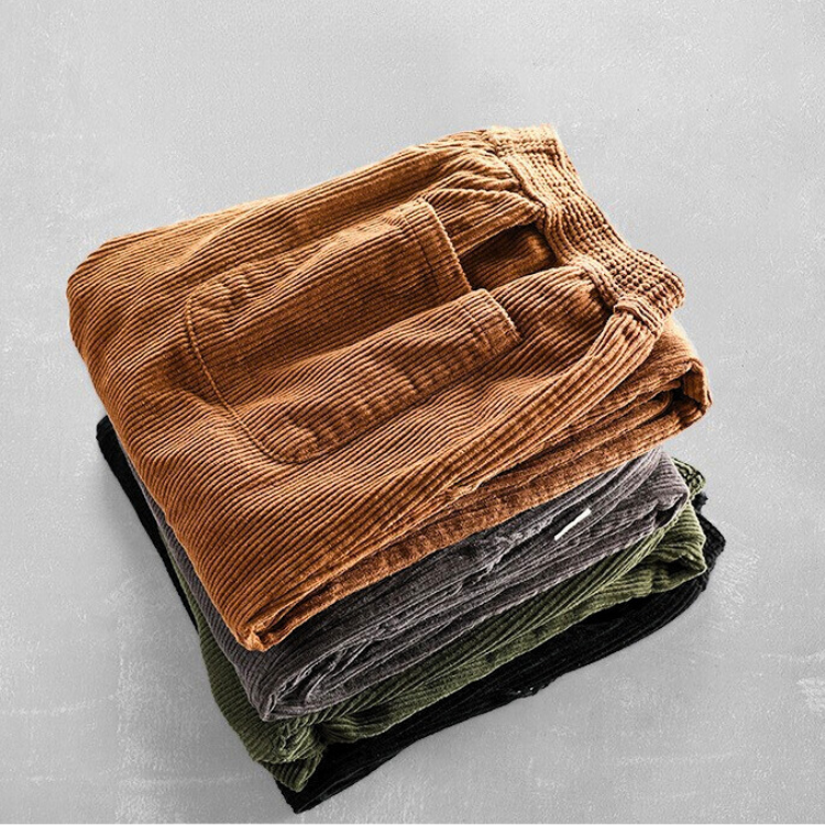 Corduroy pants with elastic waist, side pockets and tapered legs